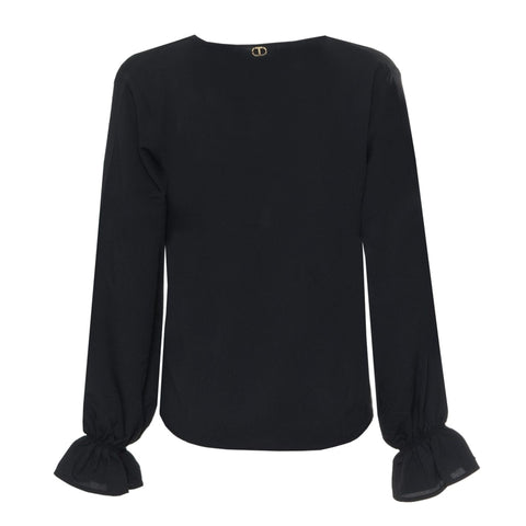 Twinset by Jag Couture London and New York, featuring a stylish knitted sweater with intricate patterns and a cozy fit.