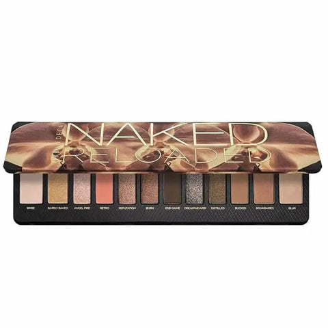 Urban Decay Naked Reloaded eyeshadow palette by Jag Couture London featuring 12 neutral and warm shades in sleek packaging.