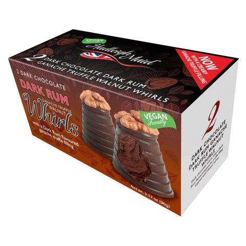 Vegan-friendly dark chocolate rum ganache walnut whirls twin pack by Jag Couture London New York on a white plate.