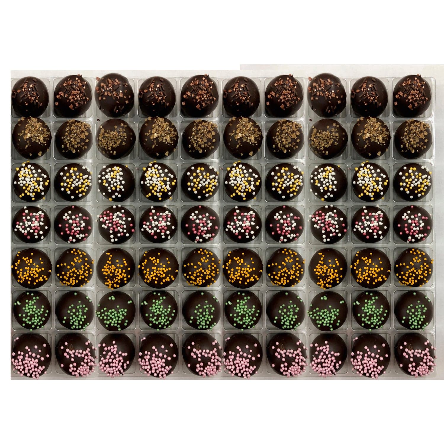 Assorted vegan truffles by Jag Couture London-New York with flavors like coffee, spiced rum, champagne, cherry Bakewell, orange, lime, raspberry.