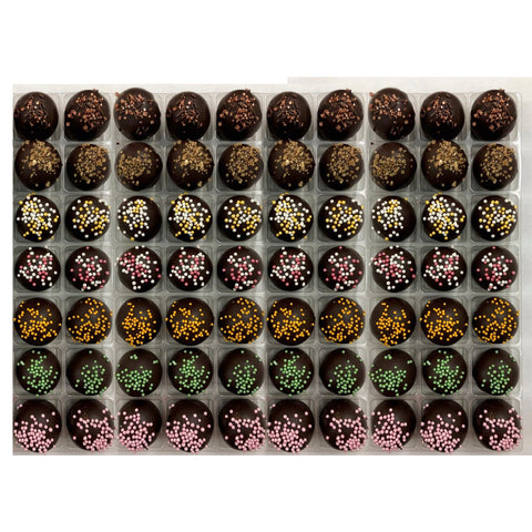 Assorted vegan truffles by Jag Couture London-New York with flavors like coffee, spiced rum, champagne, cherry Bakewell, orange, lime, raspberry.