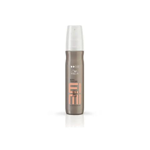 Wella Eimi Volume Body Crafter Spray 150ml held in hand, showcasing its label and spray nozzle, on a neutral background.
