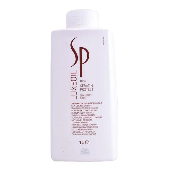 Wella Sp Luxeoil Keratin Protect Shampoo 1000ml in a sleek bottle with a pump, featuring the Jag Couture London New York branding.