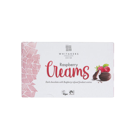 Dark chocolate-covered raspberry fondant creams by Whitakers in a carton, presented by Jag Couture London New York.