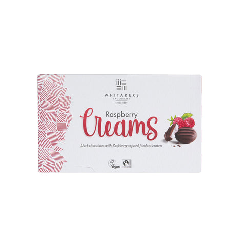 Dark chocolate covered raspberry fondant creams by Jag Couture London - New York in a carton, featuring glossy chocolates with raspberry filling.