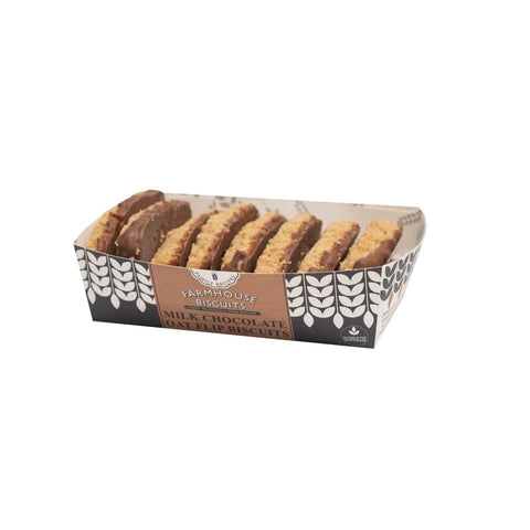 Farmhouse milk chocolate oat flip biscuits in a tray by Jag Couture London New York, showing golden-brown biscuits with chocolate coating.