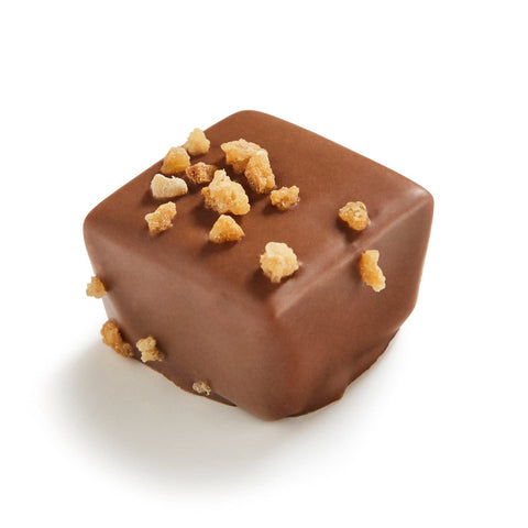 Milk chocolate praline with Bresilienne filling from Funes by Jag Couture London New York, shown as a 14g chocolate piece.