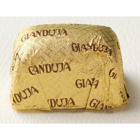 Milk chocolate Gianduja from Jag Couture London in foil wrapping, featuring smooth milk chocolate covered hazelnut filling, 16.2g.