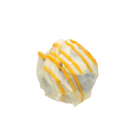 Jag Couture London New York gin and orange blossom truffle enrobed in white chocolate, 13g, with smooth white coating and orange blossom accents.