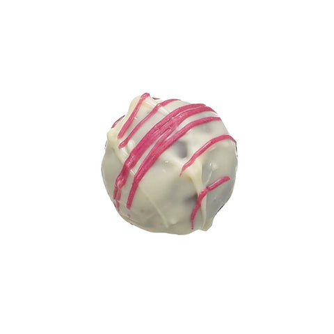 White chocolate-enrobed gin and rose truffle by Jag Couture London New York, 13g, shown with glossy white coating and elegant presentation.