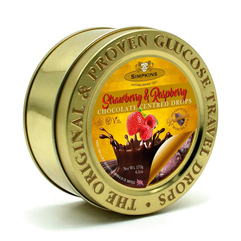 Gold embossed tin of Jag Couture London travel sweets filled with chocolate-centred strawberry and raspberry flavors.