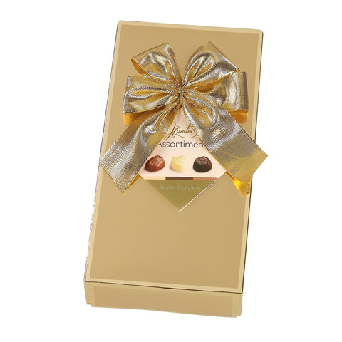 Hamlet gold gift box of assorted chocolates by Jag Couture London - New York, featuring elegant packaging and a variety of chocolates.
