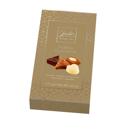 Gold box of assorted chocolates from Jag Couture London - New York's Hamlet Praline Collection, with a variety of pralines inside.