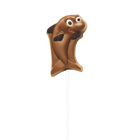Hand-decorated chocolate shark lollipops from Jag Couture London in a display, featuring detailed shark designs and glossy finish.