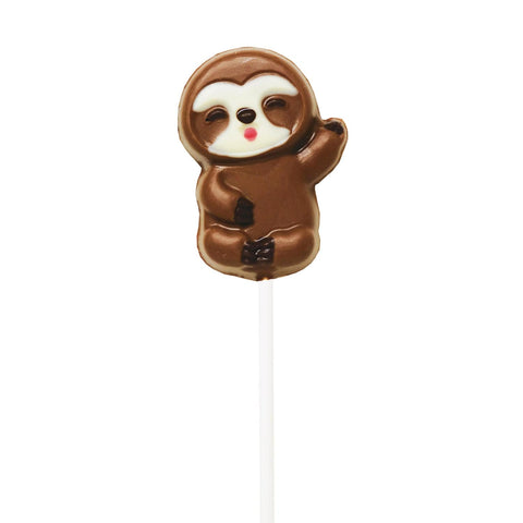 Hand-decorated chocolate sloth lollipops displayed on a tray, featuring detailed designs from Jag Couture London - New York.