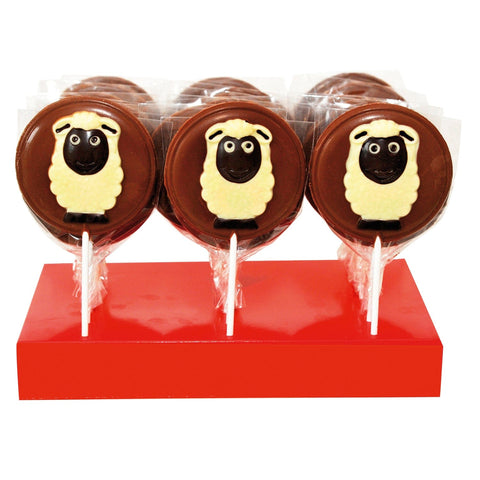 Hand-decorated milk chocolate sheep lollipops displayed together, crafted by Jag Couture London - New York.