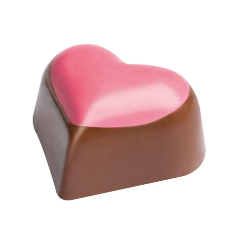 Jag Couture London - New York Heart praline hazelnut cream in milk chocolate with pink dot, 13g, close-up of the chocolate piece.