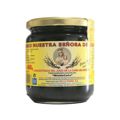 Jar of Jag Couture London Ntra. Sra. Del Carmen sugarcane honey molasses, 460g, with a label and product packaging visible.