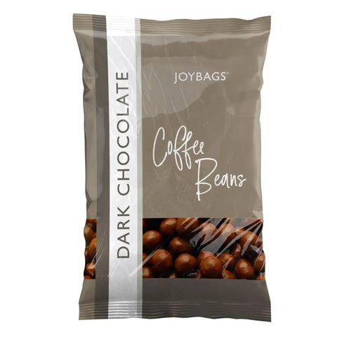 Dark chocolate covered coffee beans by Jag Couture London - New York in a clear jar, showcasing the glossy chocolate coating and coffee beans inside.