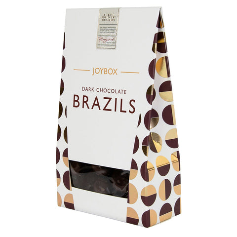 Joybox Brazil nuts coated in dark chocolate from Jag Couture London, displayed in a carton.