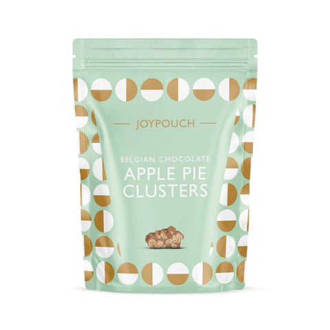 Milk chocolate-covered apple pie clusters by Jag Couture London and New York, showing the sweet, bite-sized treat with glossy coating.