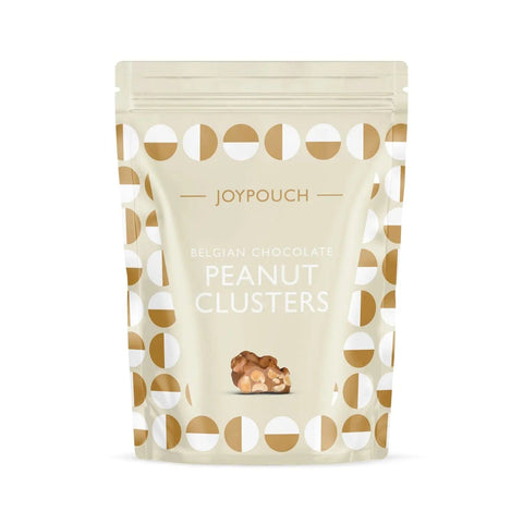 Milk chocolate covered peanut clusters from Joypouch by Jag Couture London New York, shown in a close-up image.