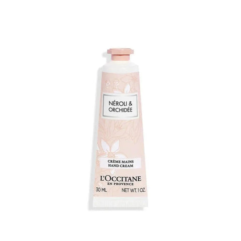 L'Occitane Neroli Hand Cream by Jag Couture London, 30ml tube showing elegant packaging and vibrant Neroli flower design.