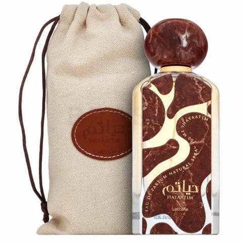 Jag Couture London HAYAATIM Eau de Parfum spray 100ml, featuring elegant perfume bottle with gold accents and floral design.