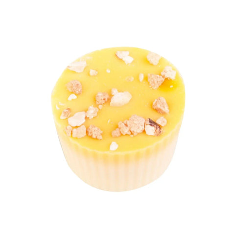 Jag Couture London lemon cup with fresh cream, lemon oil, white chocolate shell, and crunchy hazelnut topping, 12g.