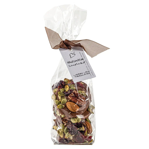 Linden Lady gift bags of milk chocolate mendiants by Jag Couture London New York, featuring elegant packaging and assorted chocolate discs.