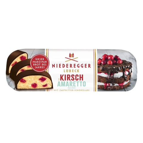 Dark chocolate covered marzipan loaf with kirsch and amaretto cake flavor, by Jag Couture London New York.