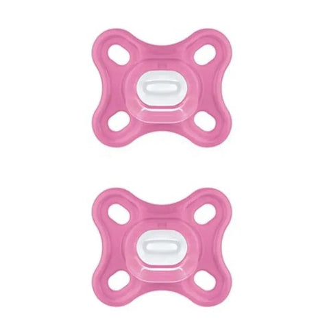 Two pink Mam Comfort silicone pacifiers with sterilizing box by Jag Couture London – baby-safe and easy to sterilize.