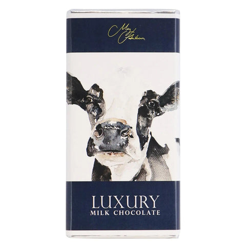 Milk chocolate bar featuring Meg Hawkins Friesian Cow design by Jag Couture London New York, shown with detailed cow artwork on the packaging.