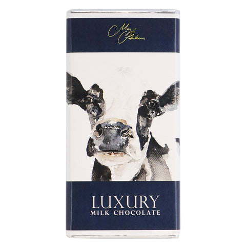 Milk chocolate bar featuring Meg Hawkins Friesian Cow design by Jag Couture London - New York, with detailed cow illustration on the packaging.