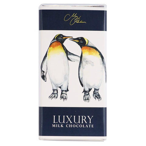 Milk chocolate bar featuring Meg Hawkins penguin design by Jag Couture London New York, wrapped in decorative packaging.