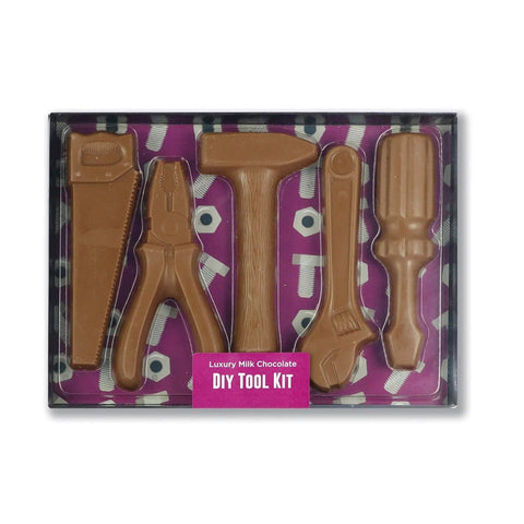 Milk chocolate DIY tool kit from Jag Couture London in a black gift box with a clear lid, perfect for chocolate crafting.