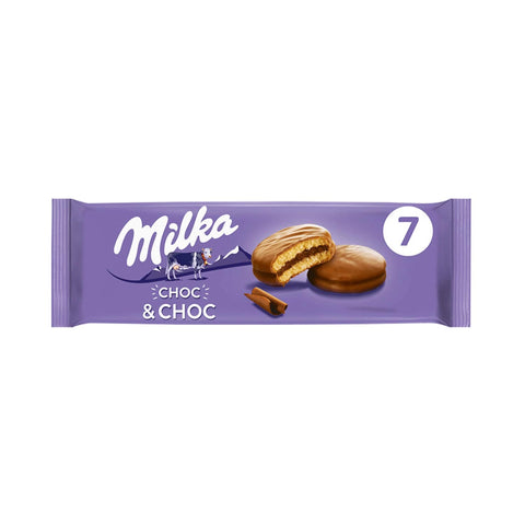 Milka Choc & Choc biscuits covered in smooth milk chocolate, presented in a close-up shot showing the biscuits' texture and chocolate coating.