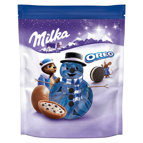 Milka milk chocolate bonbons with Oreo crème filling in a pouch by Jag Couture London - New York, showing the chocolates inside.
