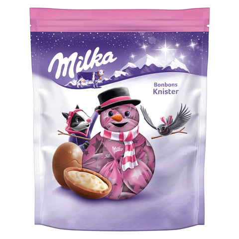 Milka milk chocolate bonbons with popping candy crème filling in a pouch, by Jag Couture London New York.