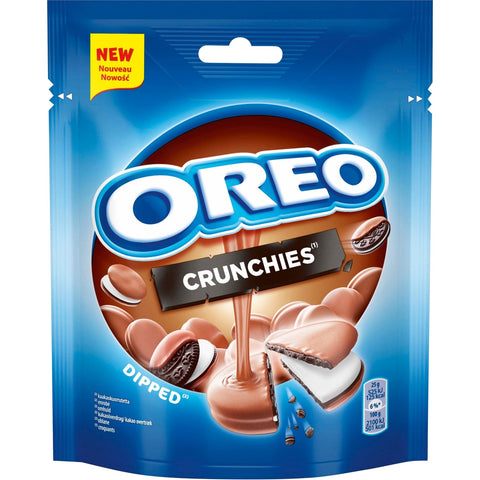 Jag Couture London - New York Milka Oreo Crunchies pouch with dipped milk chocolate mini biscuit pieces, showing the snack inside a clear pouch.