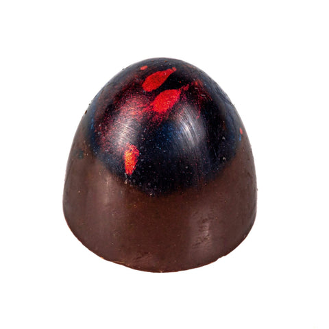 Jag Couture London Morello Cherry Bullet: dark chocolate with cherry caramel, 10g, close-up of the chocolate piece with cherry filling.
