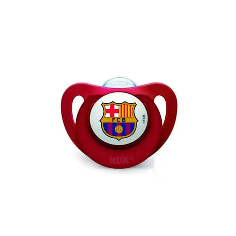 Nuk silicone pacifier with FC Barcelona logo for 6-18 months, featuring a soft teat and colorful team branding.