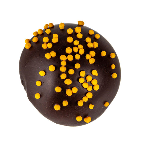 Orange truffle flavored oatmilk ganache in dark chocolate, 12.8g, by Jag Couture London New York, shown in elegant packaging.