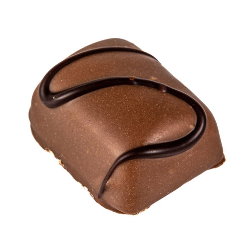 Peanut Crunch praline in milk chocolate by Jag Couture London New York, 14g, close-up of the coated peanut treat.