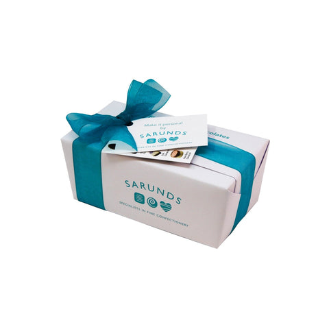 Personalised wrapped ballotin of assorted English chocolates by Jag Couture London - New York, with colorful wrapping and elegant presentation.