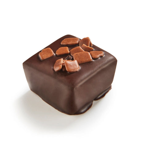 Piro bitter ganache in 72% dark chocolate, 11g by Jag Couture London New York, showing a close-up of the chocolate treat.