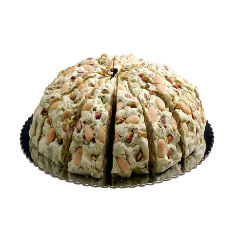 Pistachio flavored handmade soft nougat cake by Jag Couture London New York, showcasing a creamy, nutty dessert with pistachio pieces.