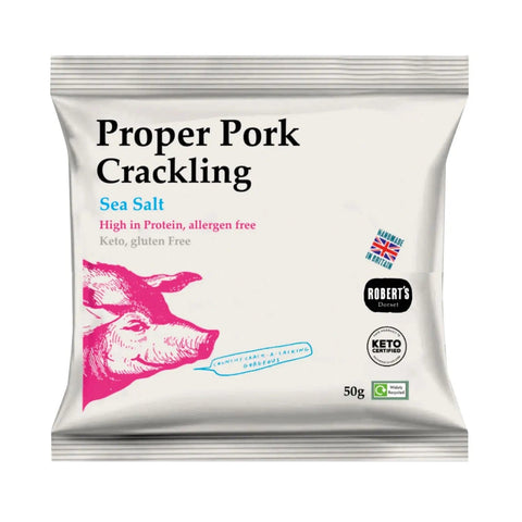 Jag Couture London Proper Pork Crackling flavored with sea salt, showcasing crispy pork crackling pieces in a natural setting.