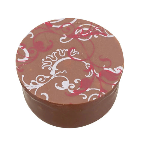 Jag Couture London milk chocolate with raspberry and cranberry, flavored crème fraîche, 14g, close-up of the packaged treat