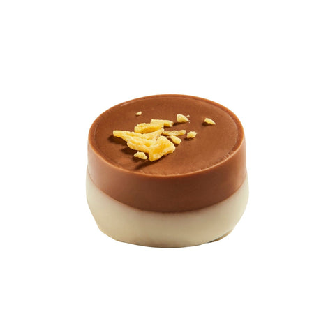 Milk chocolate cup filled with Grand Marnier ganache by Ravel, presented in a luxurious packaging from Jag Couture London New York.